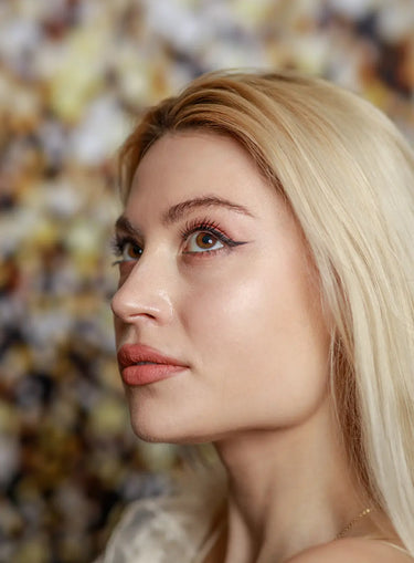 Closeup photo of young blonde looking up