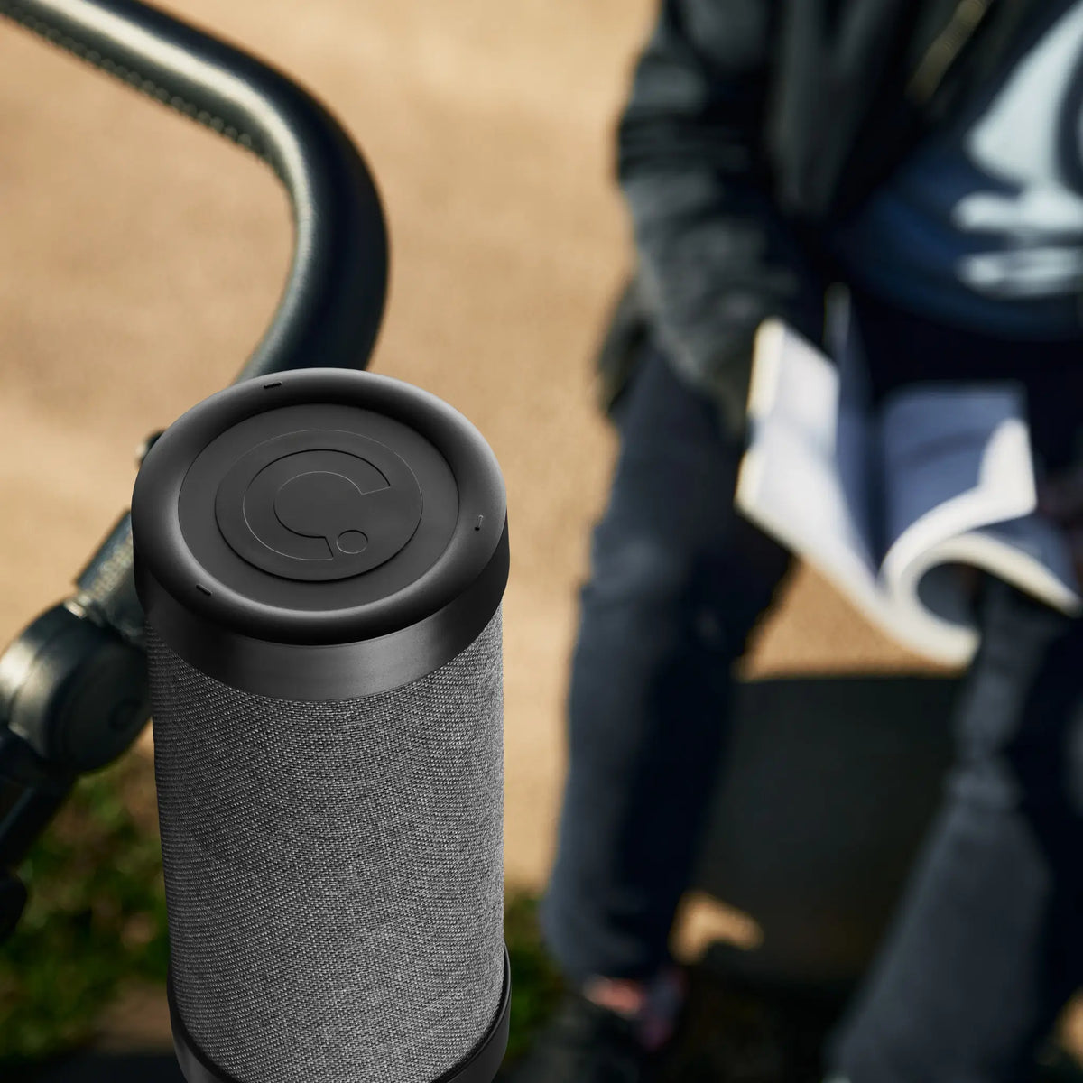 Close-up of RockingRide attached to a stroller handle, showcasing its sleek top design.